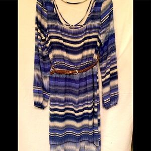 Black and blue Dress that is shorter in the front and Crisscross’s in the back.